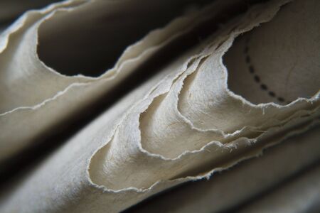 Macro shots folded a newspaper closeup pictureの写真素材