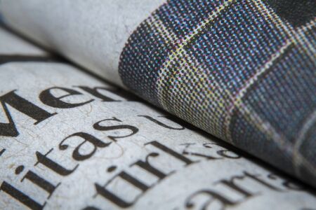 Macro shots folded a newspaper closeup picture
