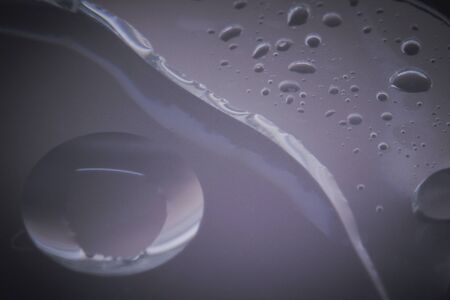 Macro shots bubbles look floating are cooking oil mixed with water  on the glass surface