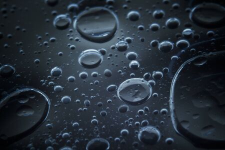 Macro shots bubbles look floating are tiny shapes of cooking oil mixed with water  on the glass...
