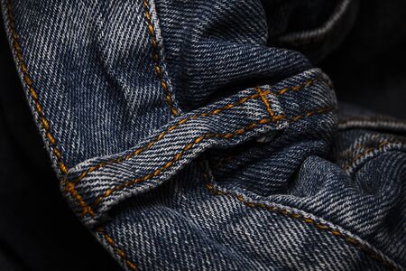 A close-up picture of crinkle blue jeansの写真素材
