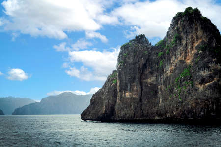 A beautiful and pristine small remote island view from the boatの写真素材