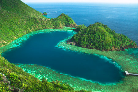 Karawapop, a heart-shaped lagoon in the cluster of West Papua island, Raja Ampat Indonesia
