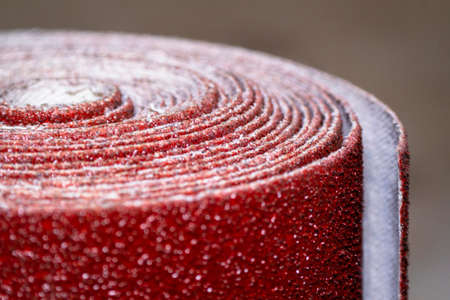 Macro shots a roll red colour belt sander sandpaperの写真素材