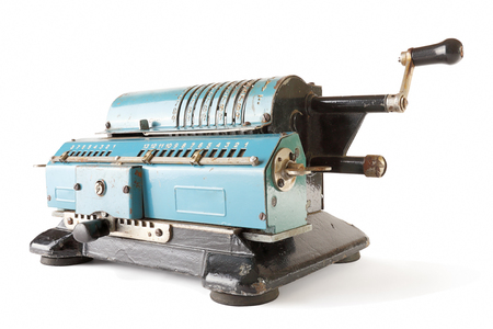 Old blue calculating machine on a white background.の写真素材