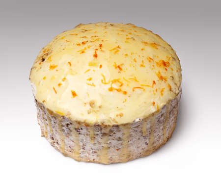 biscuit creamy cake glazed with translucent yellow glaze and decorated with shavings of orange peelの写真素材
