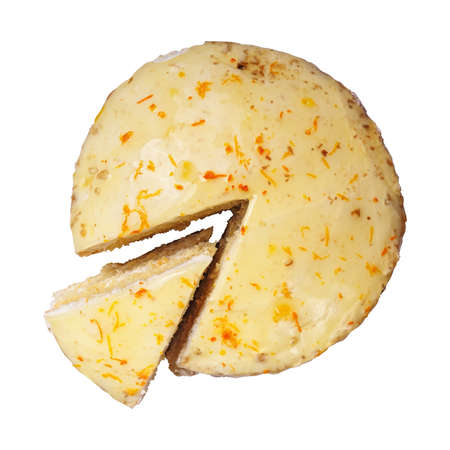 biscuit creamy cake glazed with translucent yellow glaze and decorated with shavings of orange peel with a cut out piece isolated on a white background. Ttop view.の写真素材