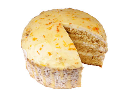 biscuit creamy cake glazed with translucent yellow glaze and decorated with shavings of orange peel with a cut out piece isolated over white background.の写真素材