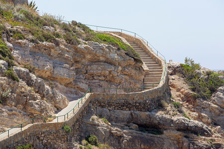 stone stairs on a rock on a sunny day, Salou, Spain.