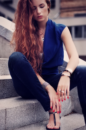 Young woman outdoors portrait. Soft sunny colorsの写真素材