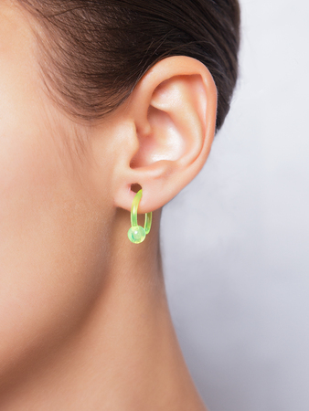 Close up image of female ear with earringの写真素材