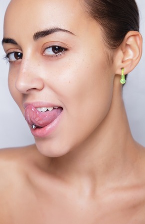 Close up image of female ear with earring
