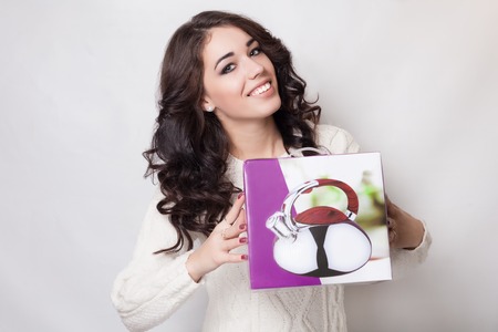 Beautiful smiling girl with gift boxの写真素材