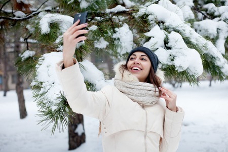 beauty girl on the winter backgroundの写真素材