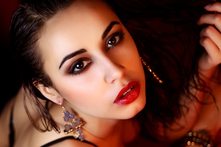 Fashion shoot of young blond woman. Sexy lady. elegant woman. red background.の写真素材