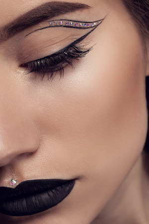 Beauty Black Lip Makeup, Beauty Fashion Model Girl with Black Make up, Long Lushes. Fashion Trendy Caviar Black Manicure.の写真素材