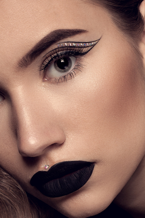 Beauty Black Lip Makeup, Beauty Fashion Model Girl with Black Make up, Long Lushes. Fashion Trendy Caviar Black Manicure.の写真素材