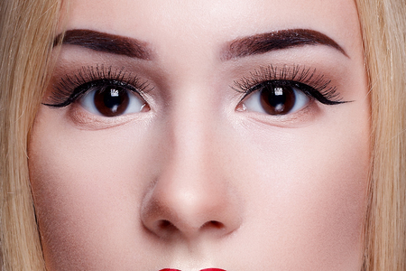 Beautiful young model woman with red lips and shine hairの写真素材