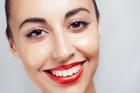 red lipstick and white teeth. woman with white teeth and red lipsの写真素材