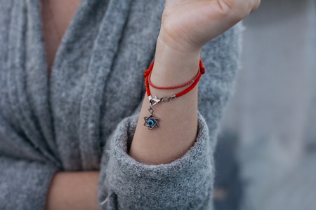 Necklace with the Star of David on a girl's handの写真素材