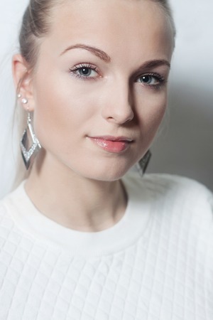 portrait of a beautiful blonde closeup. Beauty portrait of a girl model with make-up