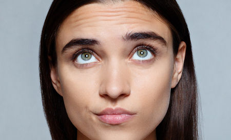people, luxury and fashion, emotions concept - Portrait of young woman with shocked facial expressionの写真素材