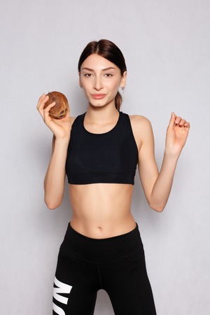 health, people, food and beauty concept - Beautiful young girl with a light natural make-up and...