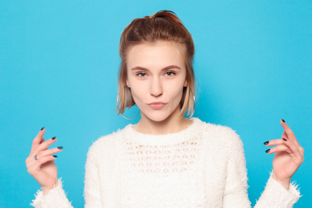 healthy lifestyle, happiness and people concept - The young woman's portrait with happy emotions. Laughing, smiling, anger, suspicion, fear, surprise.の写真素材