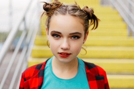High fashion look. glamor stylish beautiful young woman model with red lips in summer bright colorful hipster clothの写真素材