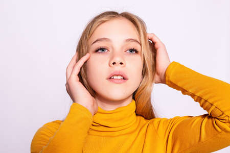 Trendy beautiful hipster girl. Photo of positive young nice woman in yellow knee-high with white background. dreamingの写真素材