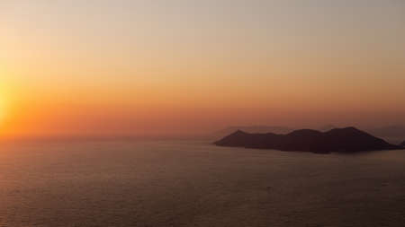 beautiful silhouette sunset. Twilight sky over the lake in the beautiful colors of the sunset afterglowの写真素材