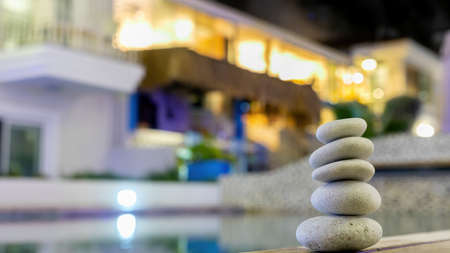 Relaxing on the pool, stack of stones. Zen and spa conceptの写真素材