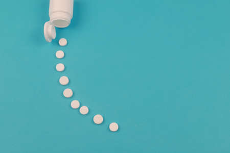 Pill bottle on blue backgroundMedical, pharmacy and healthcare concept. copyspace. Empty place for textの写真素材