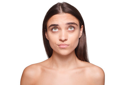 A serene portrayal of a young woman with flawless skin indulging in a pampering session. Captivate your audience with this image for beauty blogs or wellness magazines.の写真素材