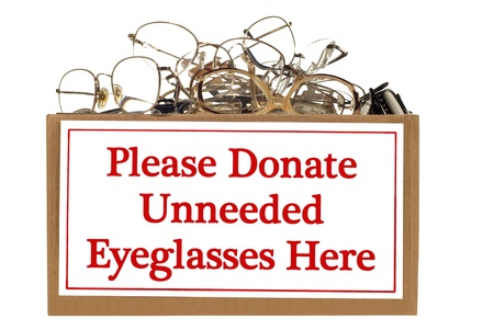 Box full of unneeded glasses ready for donation   Isolated on white   Studio shot   Horizontal shot の写真素材