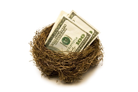 Folded hundred dollar bills put away for retirement   Everyone needs a little nest egg の写真素材