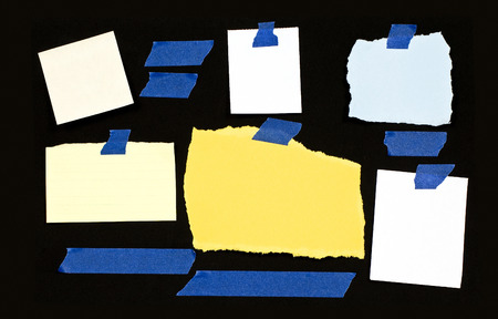 Variety Of Blank Torn Notes On Black Backgroundの写真素材