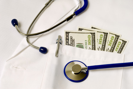 Horizontal Close Up Shot Of Doctor Pocket Full Of Money An Expensive Healthcare Concept
