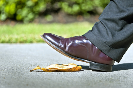 Businessman About To Slip On Banana Peelの写真素材