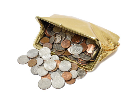 Horizontal shot of an open gold metallic coin purse on its side with coins spilling out of it on a white background.の写真素材
