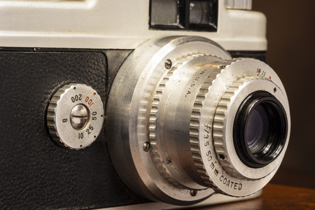 Horizontal close-up shot of an old worn and dirty camera lens from the 50sの写真素材