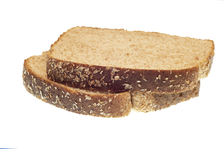 Horizontal shot of two stacked slices of whole-wheat bread isolated on white.