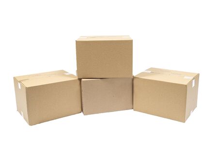 Horizontal shot of four blank stacked shipping boxes isolated on white.の写真素材
