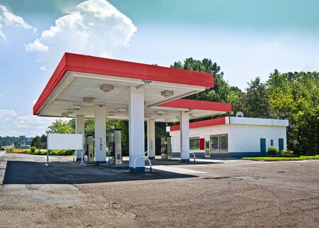 Horizontal shot of a closed out of business convenience store.
