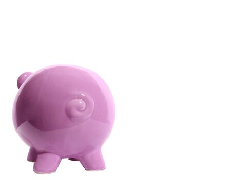 Horizontal shot of a pink piggy bank facing away from the camera on the left side of the picture.  Curly tail.  Lots of copy space on the right side.  White background.の写真素材