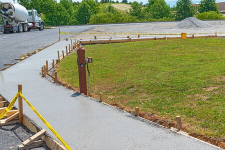 Horizontal shot of a new concrete sidewalk that has just been poured.の写真素材
