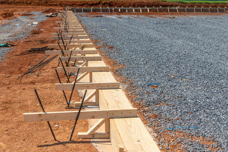 Horizontal shot of a pile of wooden framing prepared for a concrete slab to be constructed.の写真素材