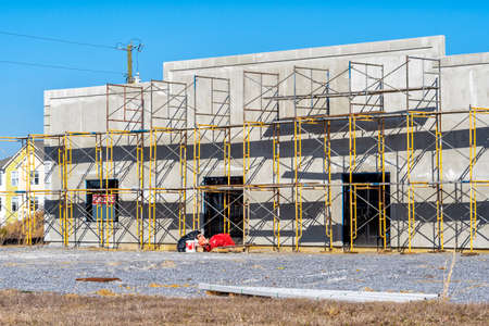 Horizontal shot of scaffolding across the front of new retail construction.