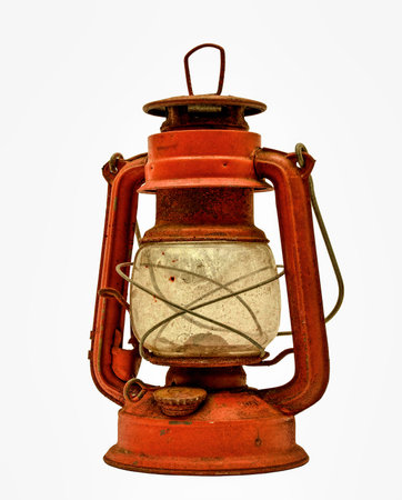 A rusty and corroded antique red lantern isolated on white with copy spaceの写真素材