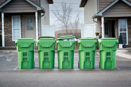 Horizontal shot of condo garbage cans waiting for the dump truck.の写真素材